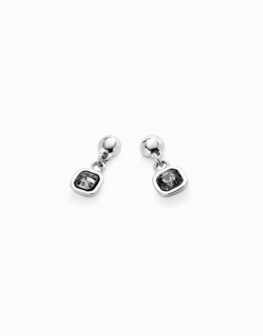 Pair of silver flower-shaped drop dangle UNOde50 ser expresiva earrings on a white background