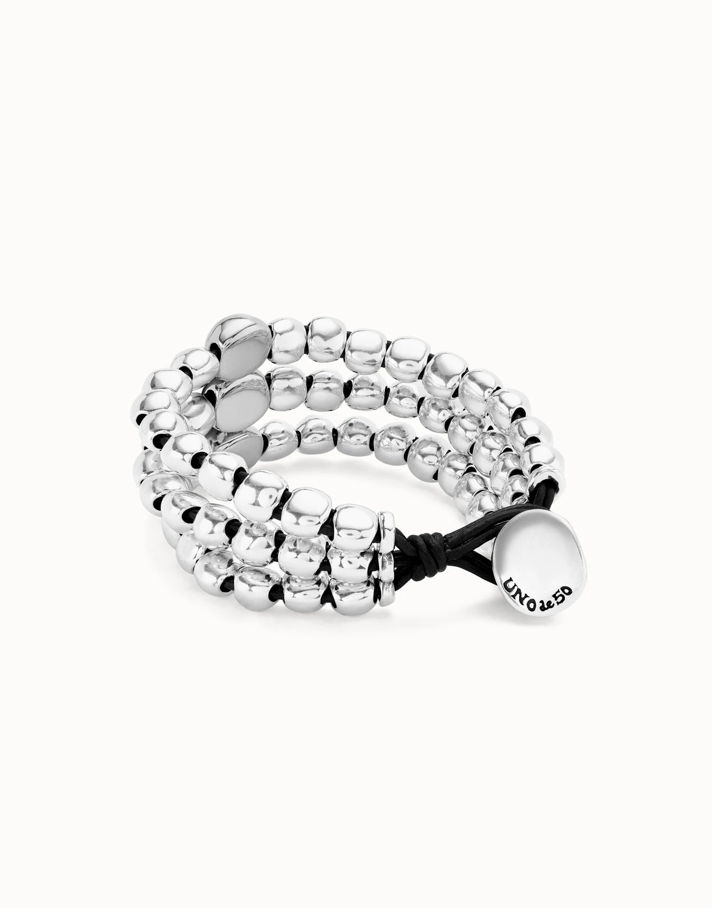 Silver 3 strand Ser Intrepida UNOde50 beaded bracelet with a black cord on a white background