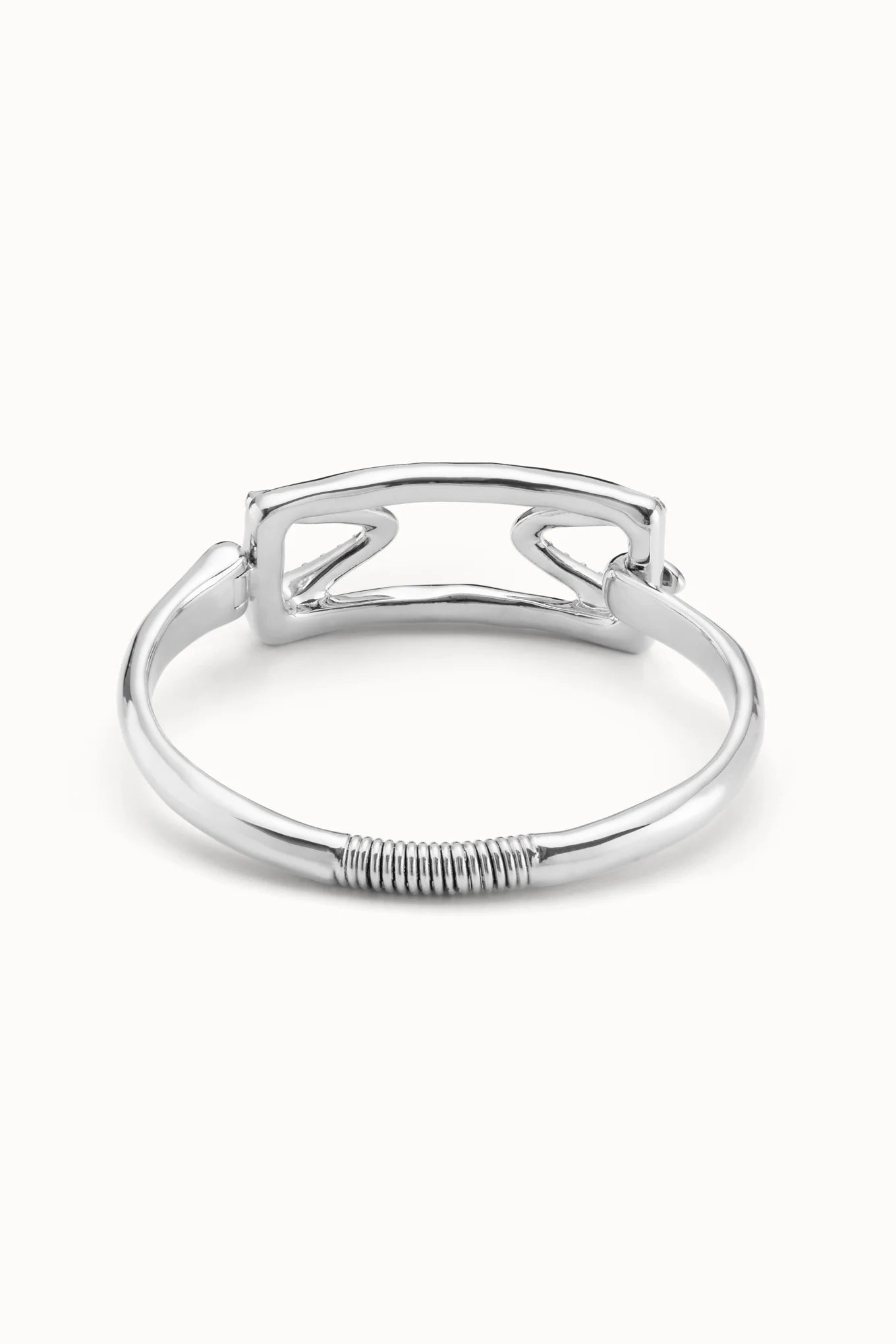 Back view of an UNOde50 Stand Out Silver Cuff Bracelet With Topaz Accent showing the spring to open the cuff