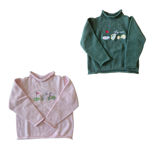 Two children's sweaters, one green and one pink, with golf embroidered designs on a white background.