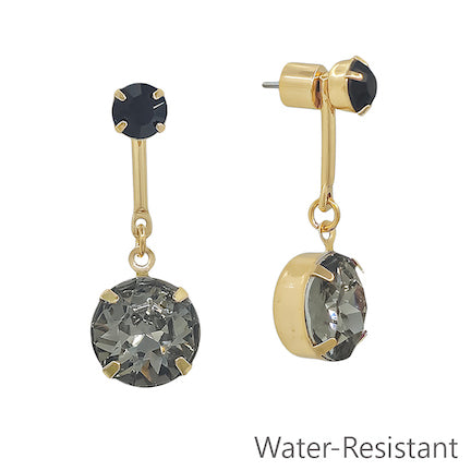 Meghan Browne  Gold drop earrings with  black gemstone stud, a gold drop and a larger black gemstone encased in gold. 
