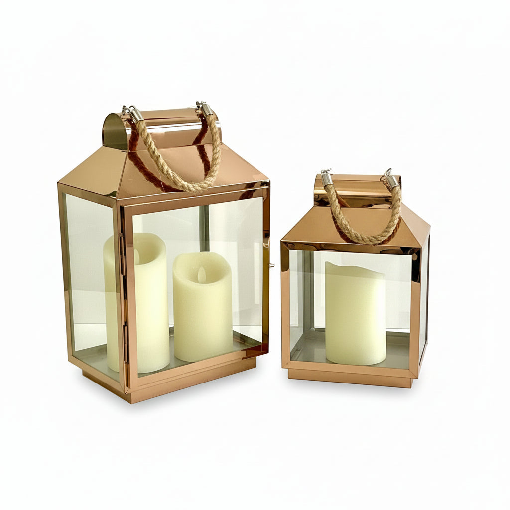 two copper lanterns with rope handles