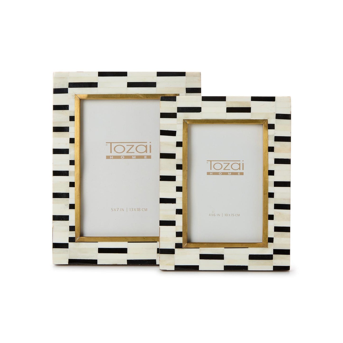 Two photo frames with black and white striped design made from bone with brass accents