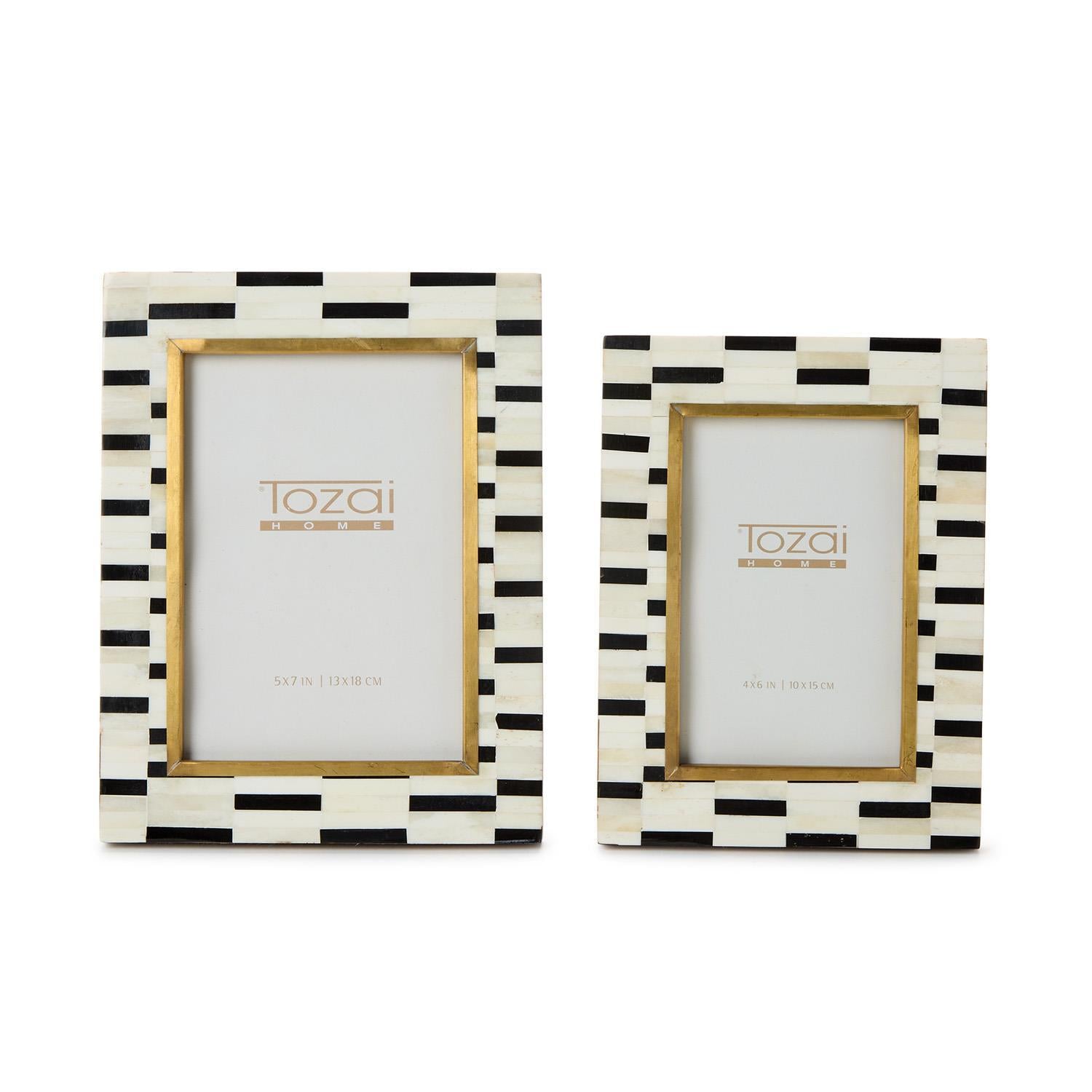Two black and white striped picture frames with gold accents on a white background, featuring the brand 'Tozai'.