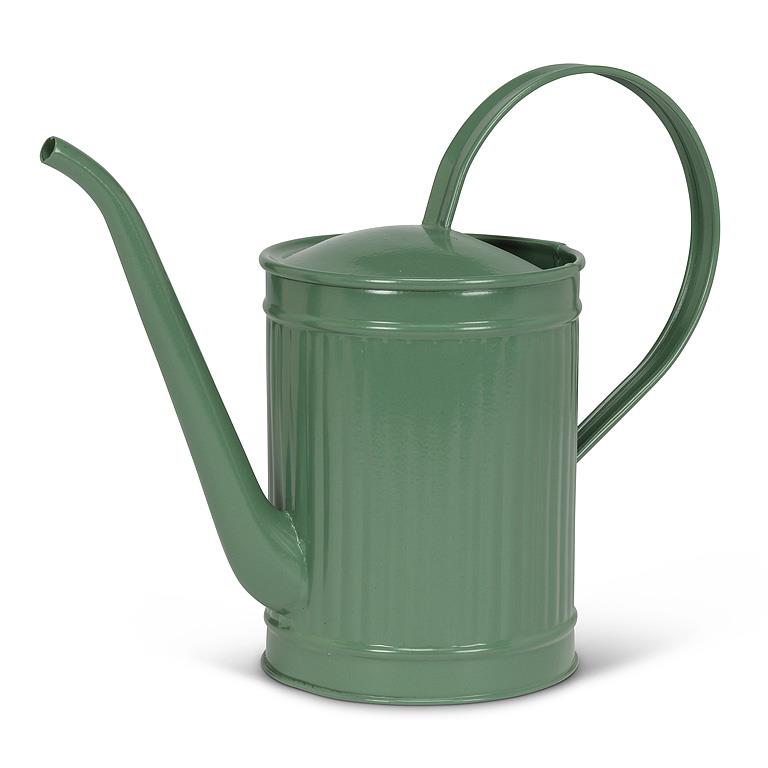 Green metal watering can with a long spout on a white background
