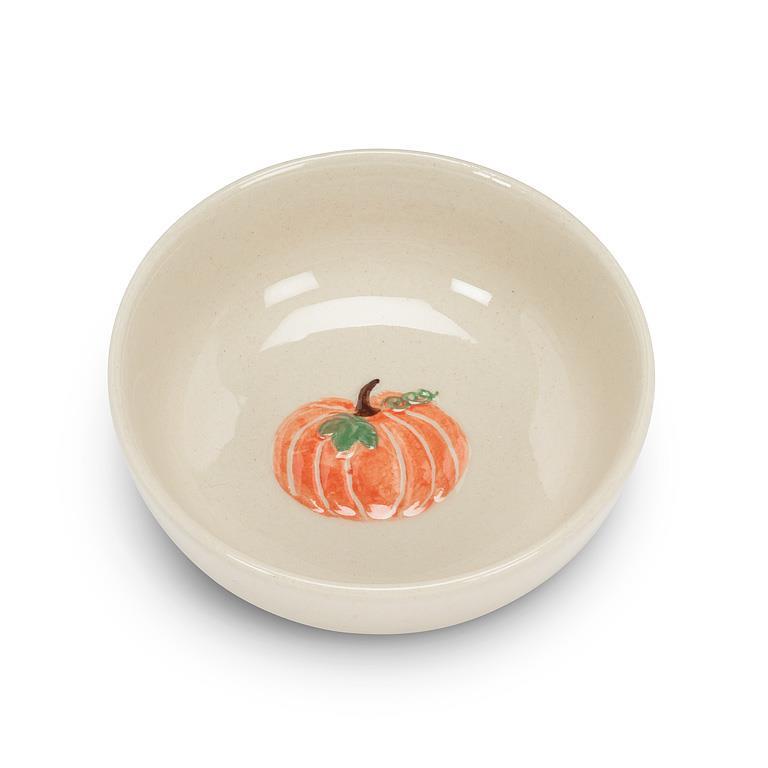 Beige ceramic bowl with a pumpkin design in the bottom of the bowl 