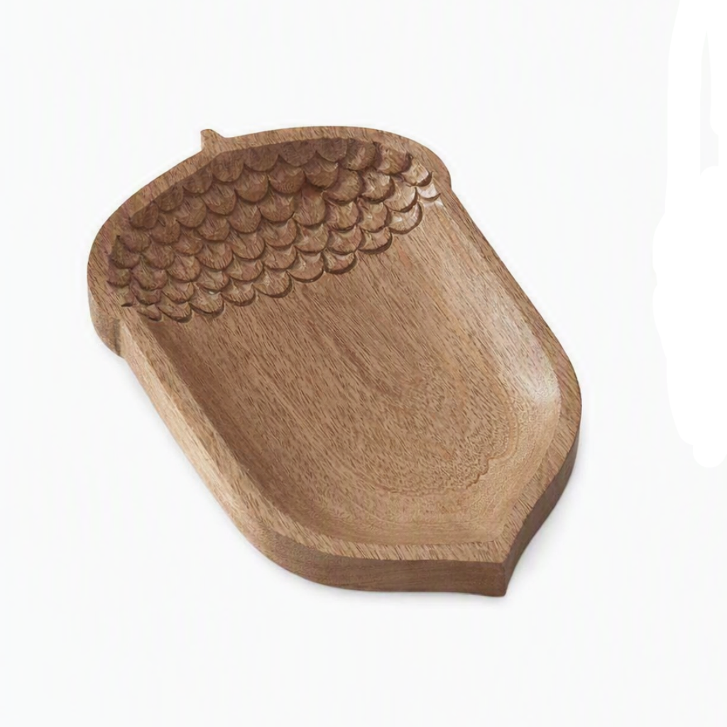 acorn-shaped wooden tray with a carved textured pattern resembling the cap of an acorn