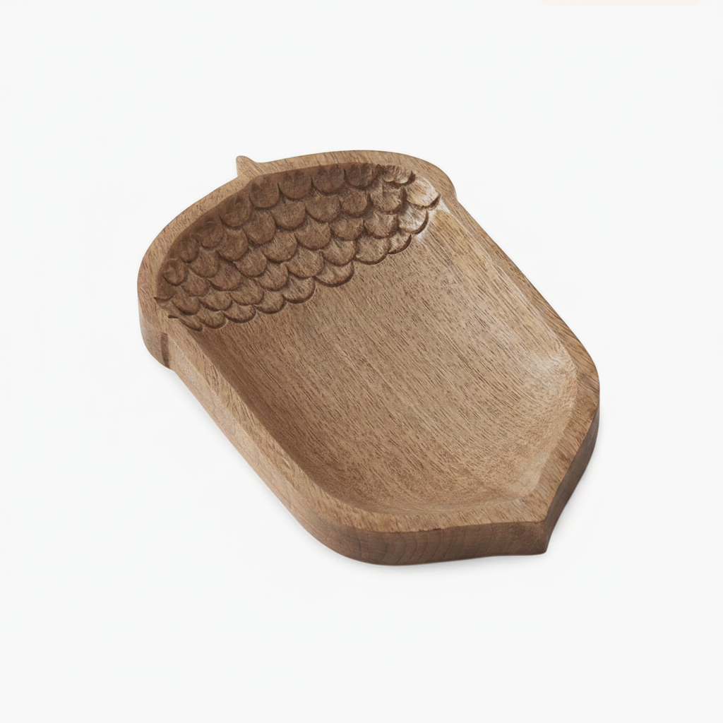 acorn-shaped wooden tray with a carved textured pattern resembling the cap of an acorn