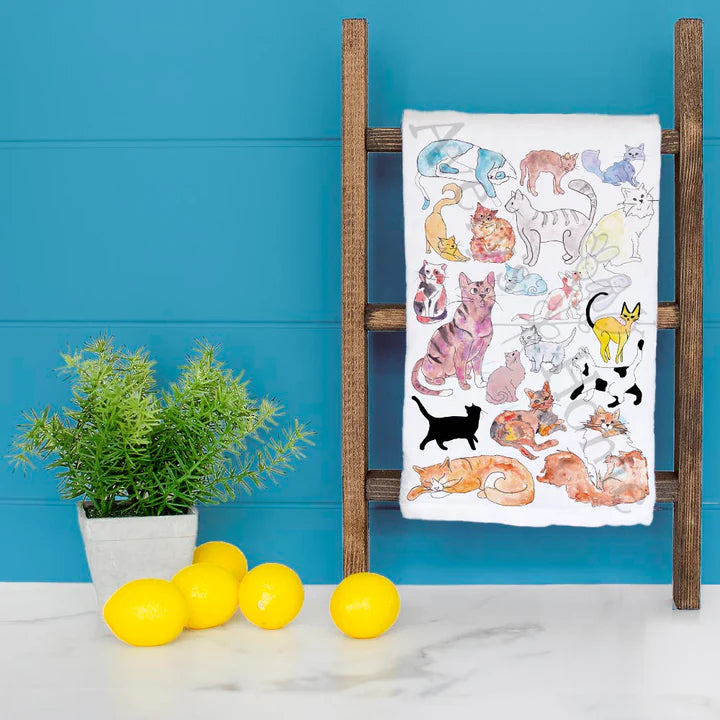 cotton tea towel with illustrations of cats 