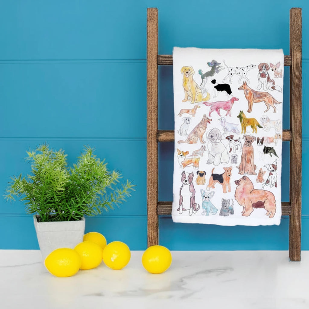 cotton tea towel with painted illustrations of various dogs