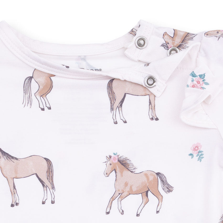 White shirt with horse illustrations and floral details on a white background