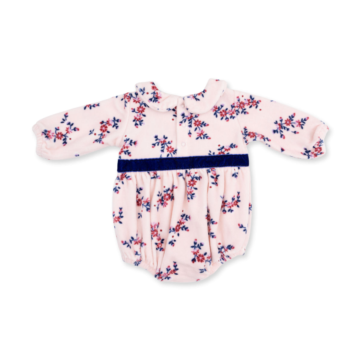 A back view of a baby long-sleeve romper in light pink velour with a navy and burgundy floral print, featuring a navy-blue velvet bow belt at the waist.