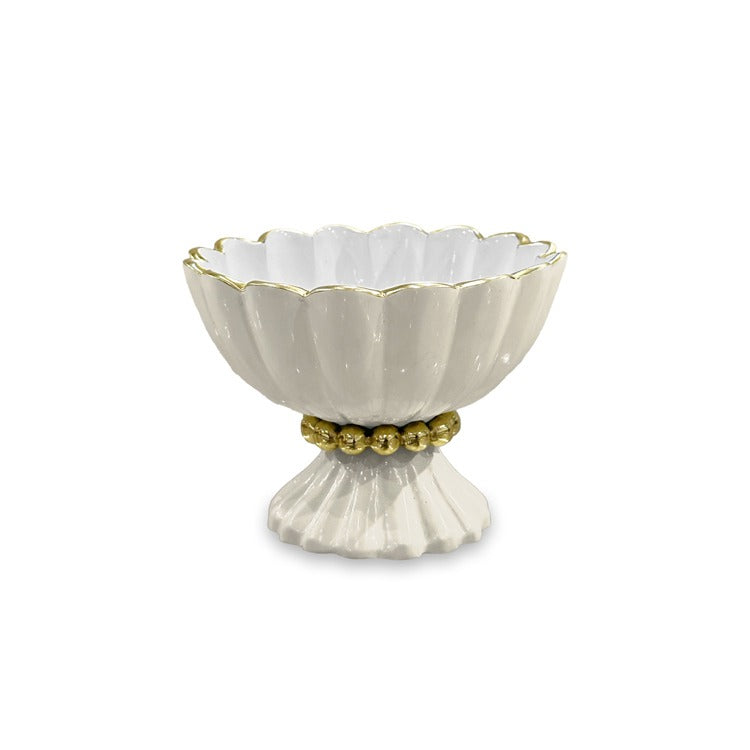 A cream and white colored mini pedestal bowl with gold pearl details and a gold spoon, crafted from aluminum alloy with a food-safe enamel finish.