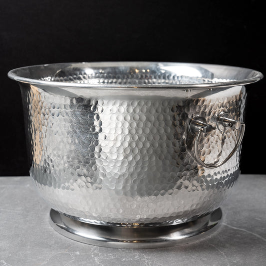 Silver hammered metal beverage tub with handles.