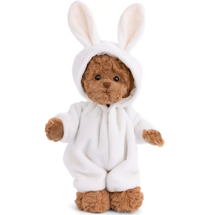 A brown plush teddy bear wearing a white bunny hooded onesie, photographed against a plain white background.