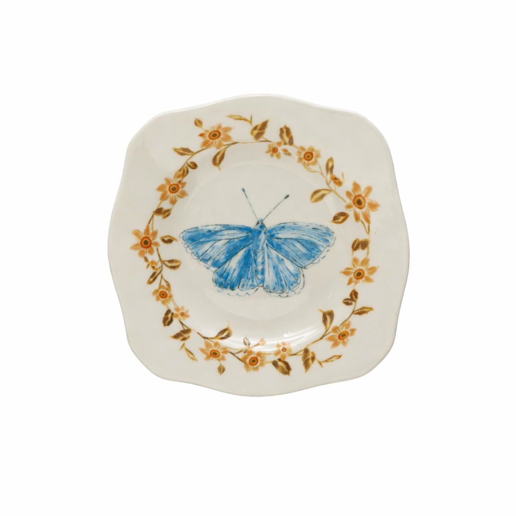 stoneware plate featuring a butterfly in a ring of flowers