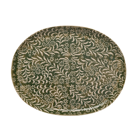 Decorative plate with a green and beige floral pattern 