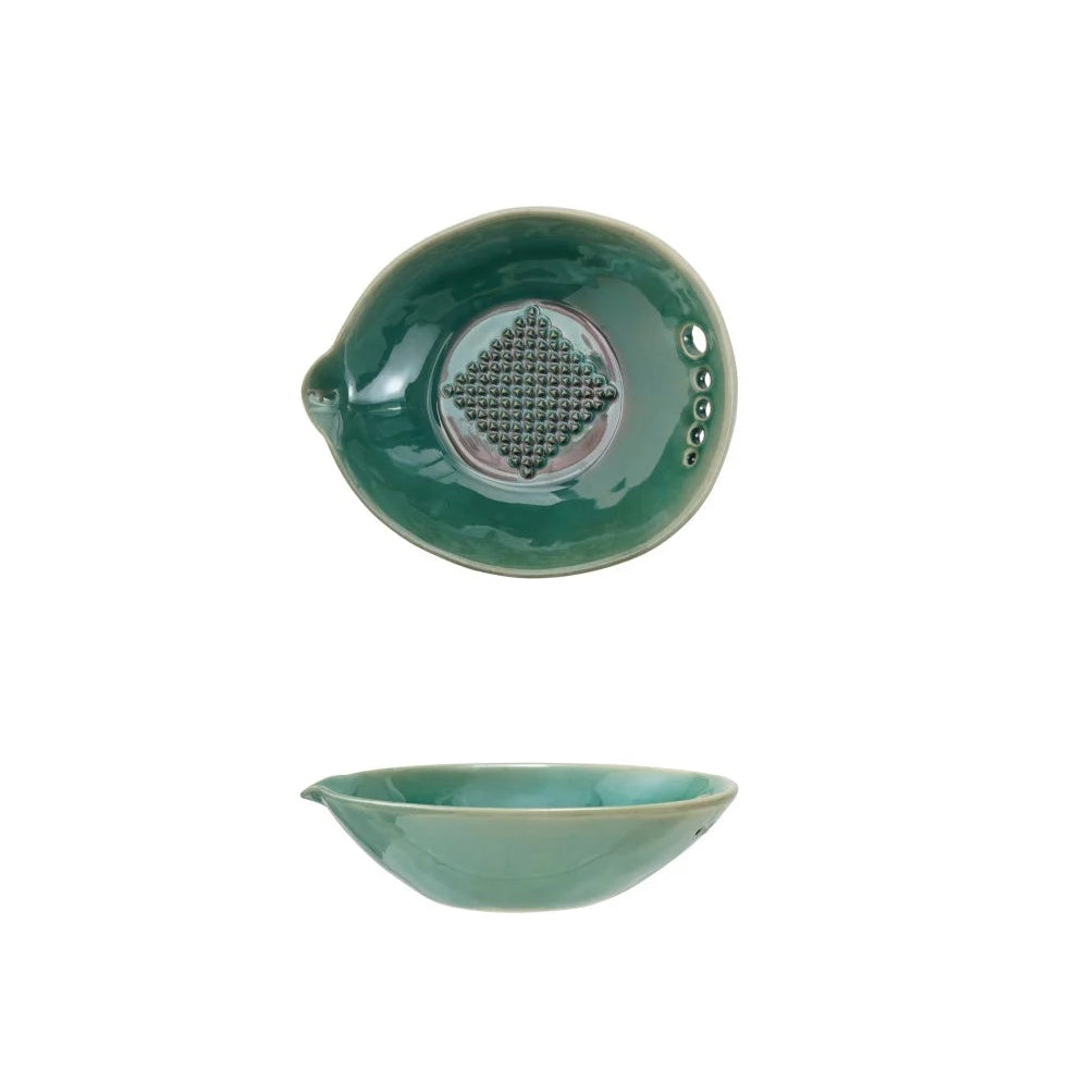 stoneware garlic grater in a green glaze with holes for stripping herbs