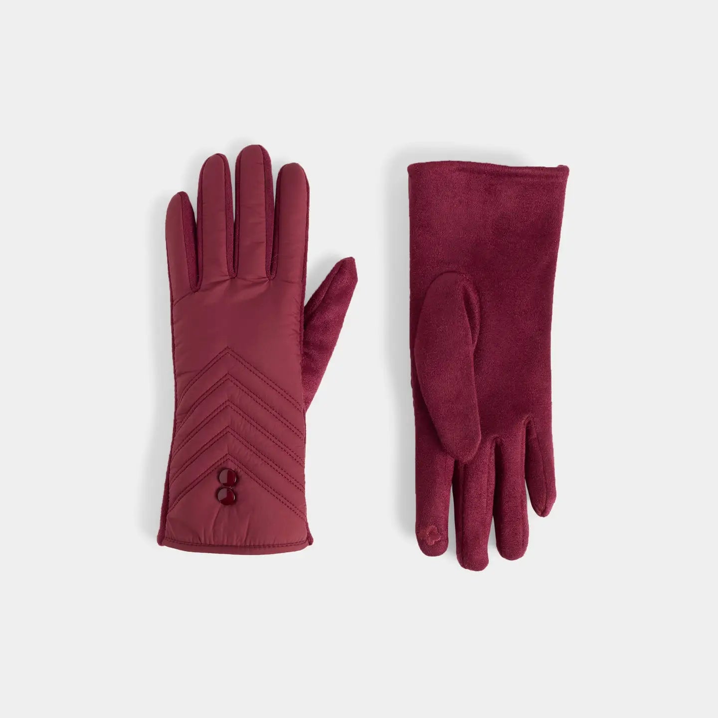 A pair of burgundy, maroon gloves displaying quilted chevron stitching and 2 buttons near the cuff