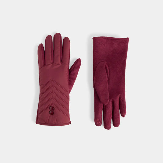A pair of burgundy, maroon gloves displaying quilted chevron stitching and 2 buttons near the cuff