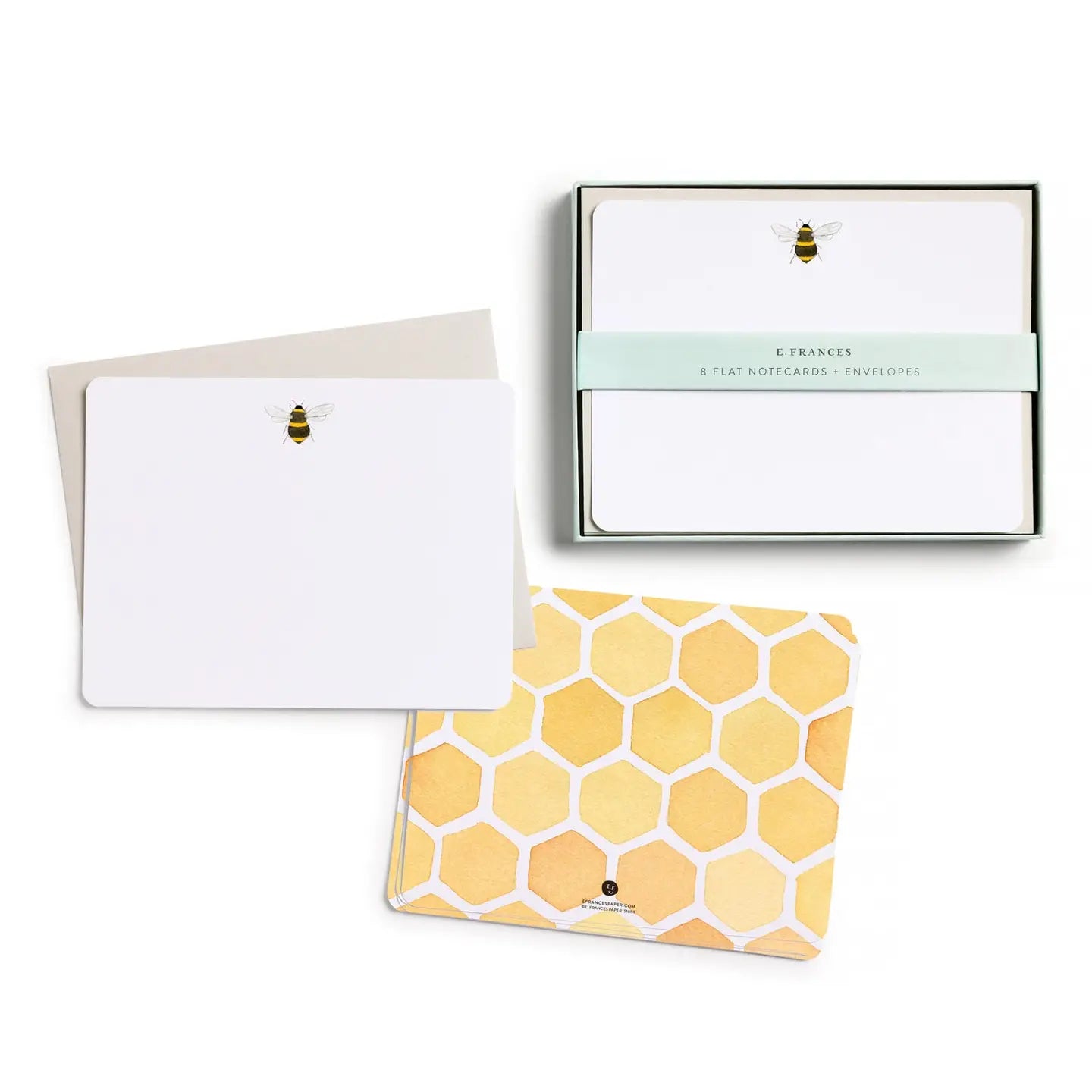 Set of flat notecards with envelopes featuring a bee design and honeycomb pattern 