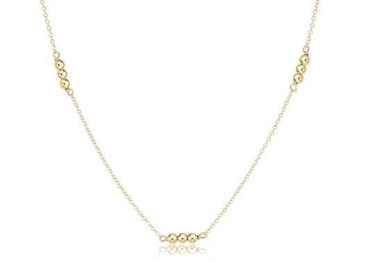 A delicate gold enewton chain Joy Simplicity 15 inch choker necklace featuring small, evenly spaced polished 3MM gold beads at the center and near the top corners, displayed on a clean white background.