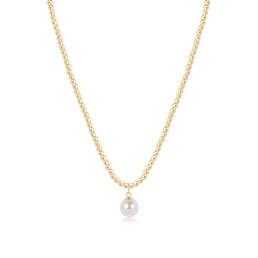 A delicate gold chain necklace featuring a single, lustrous white pearl pendant, shown against a clean white background.