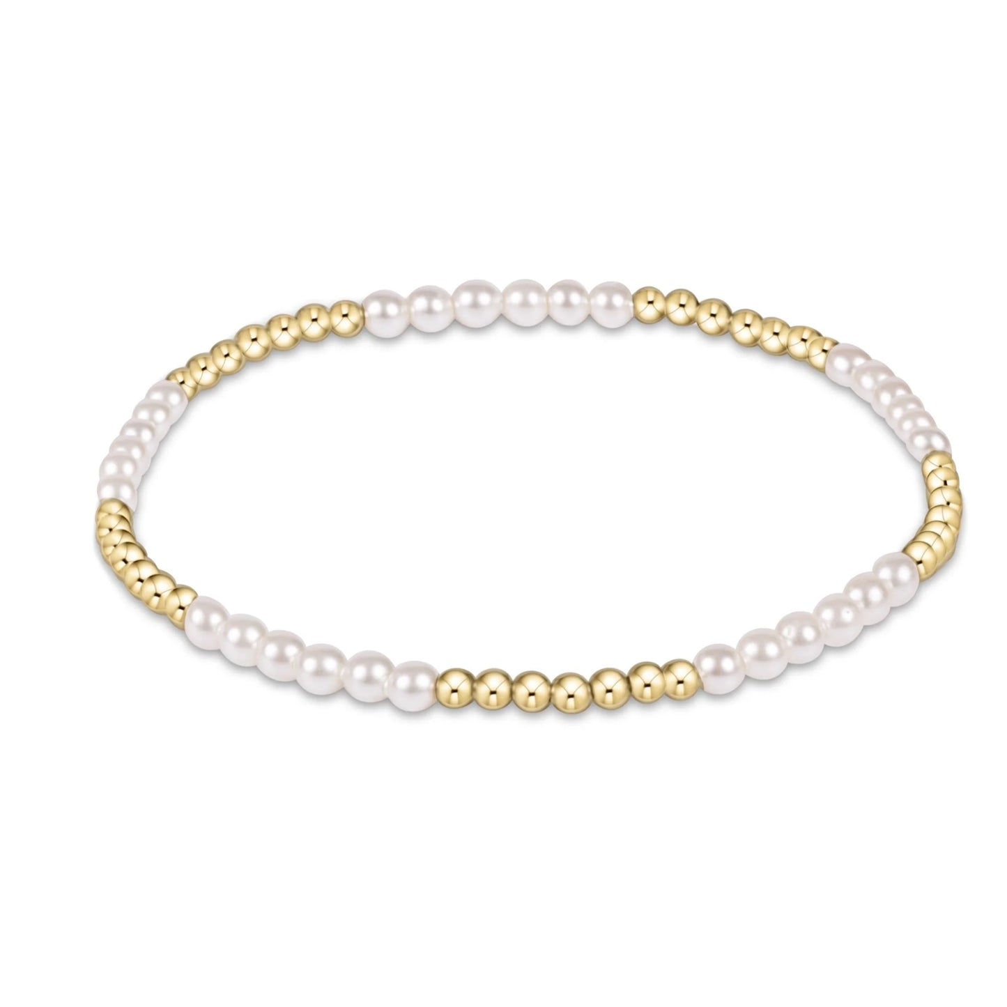 enewton blissful bracelet with several 3mm Pearl beads alternating with several and 2.5mm gold beadst on a white background