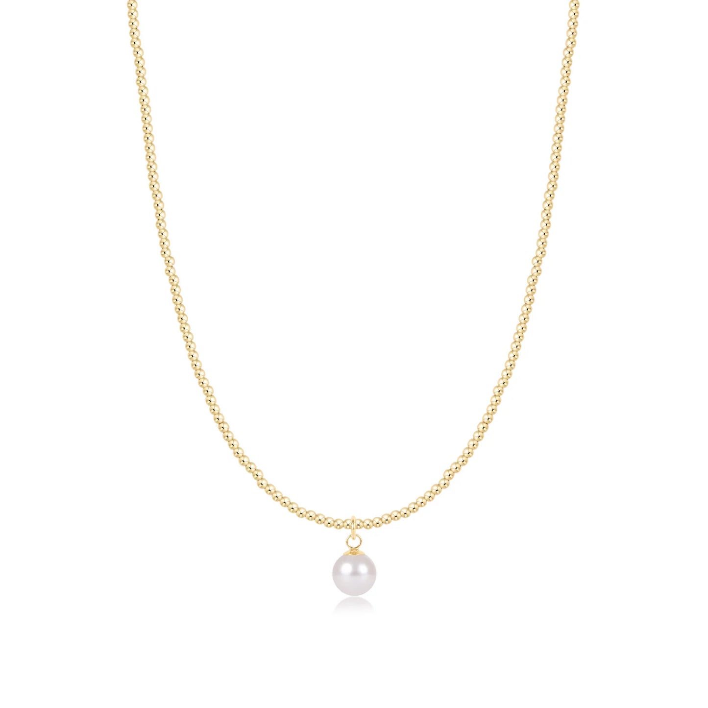 A delicate enewton classic gold 2mm beaded necklace featuring a single, lustrous 8mm white pearl pendant, displayed against a clean white background.