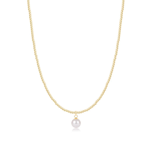 A delicate enewton classic gold 2mm beaded necklace featuring a single, lustrous 8mm white pearl pendant, displayed against a clean white background.