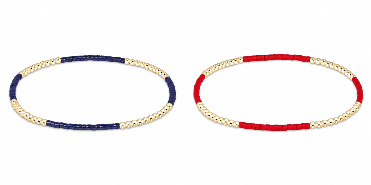 Two enewton gameday hope blissful beaded stretch bracelets on a white background, one with navy blue and gold beads and the other with red and gold beads.