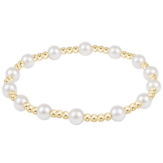 enewton Sincerity Bracelet with a pattern of one 5MM crystal Pearl bead and then three 2.5MM Gold Beads