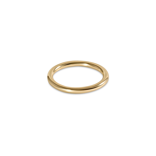 A simple gold enewton band ring with a smooth finish.