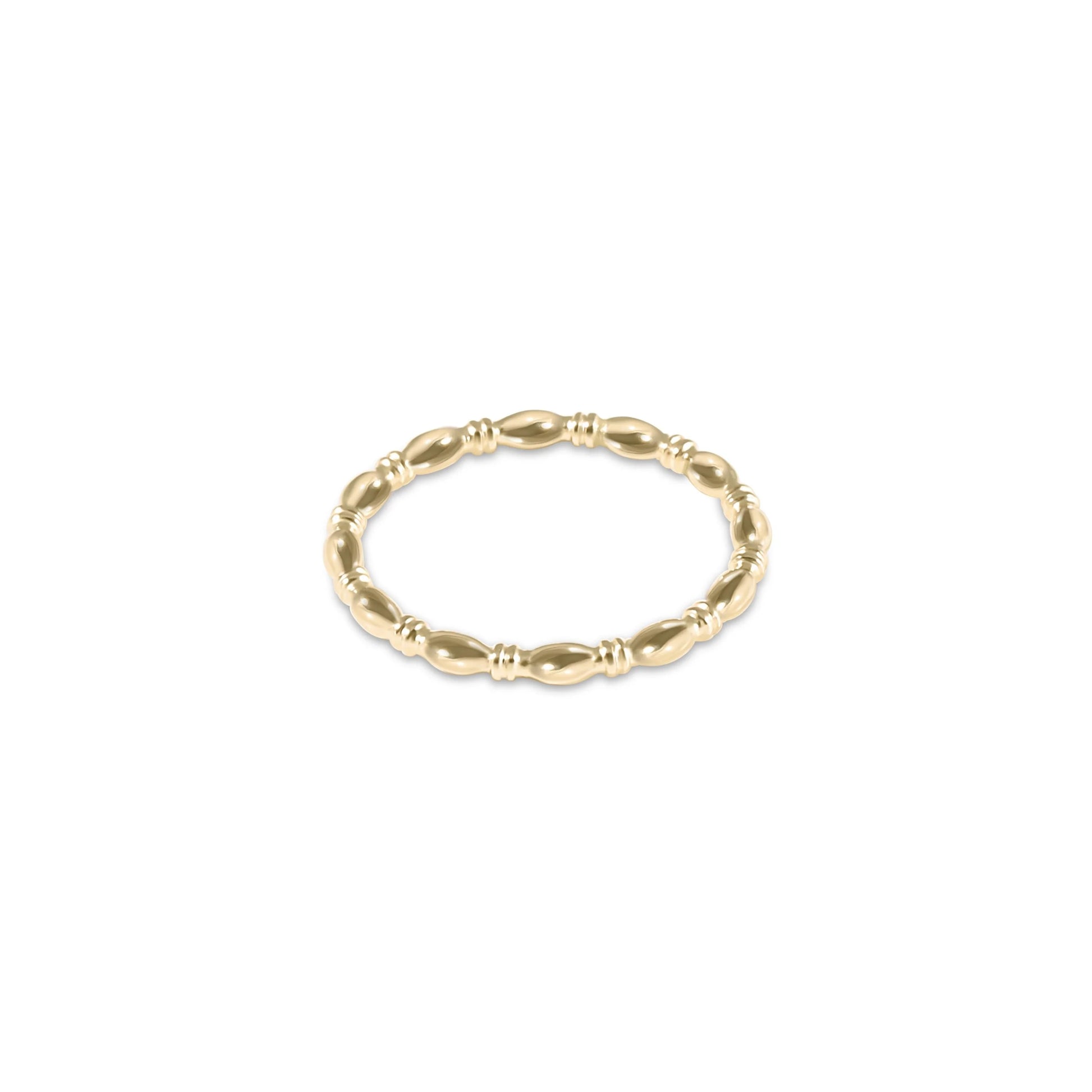 A gold-plated harmony ring by enewton with a beaded design.