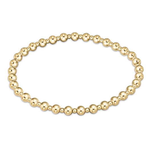 Gold beaded enewton grateful gold 3mm bracelet on a white background