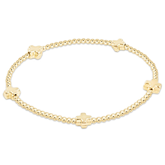 enewton signature cross bracelet with 2mm gold beads and gold cross design available at the little exchange