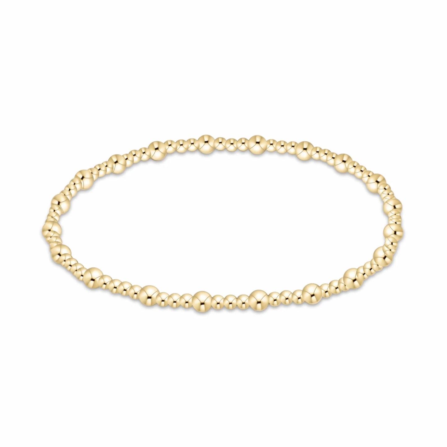 A delicate gold beaded enewton Sincerity bracelet with small, polished 3mm and 2mm spherical beads, displayed in a horizontal oval shape against a plain white background.