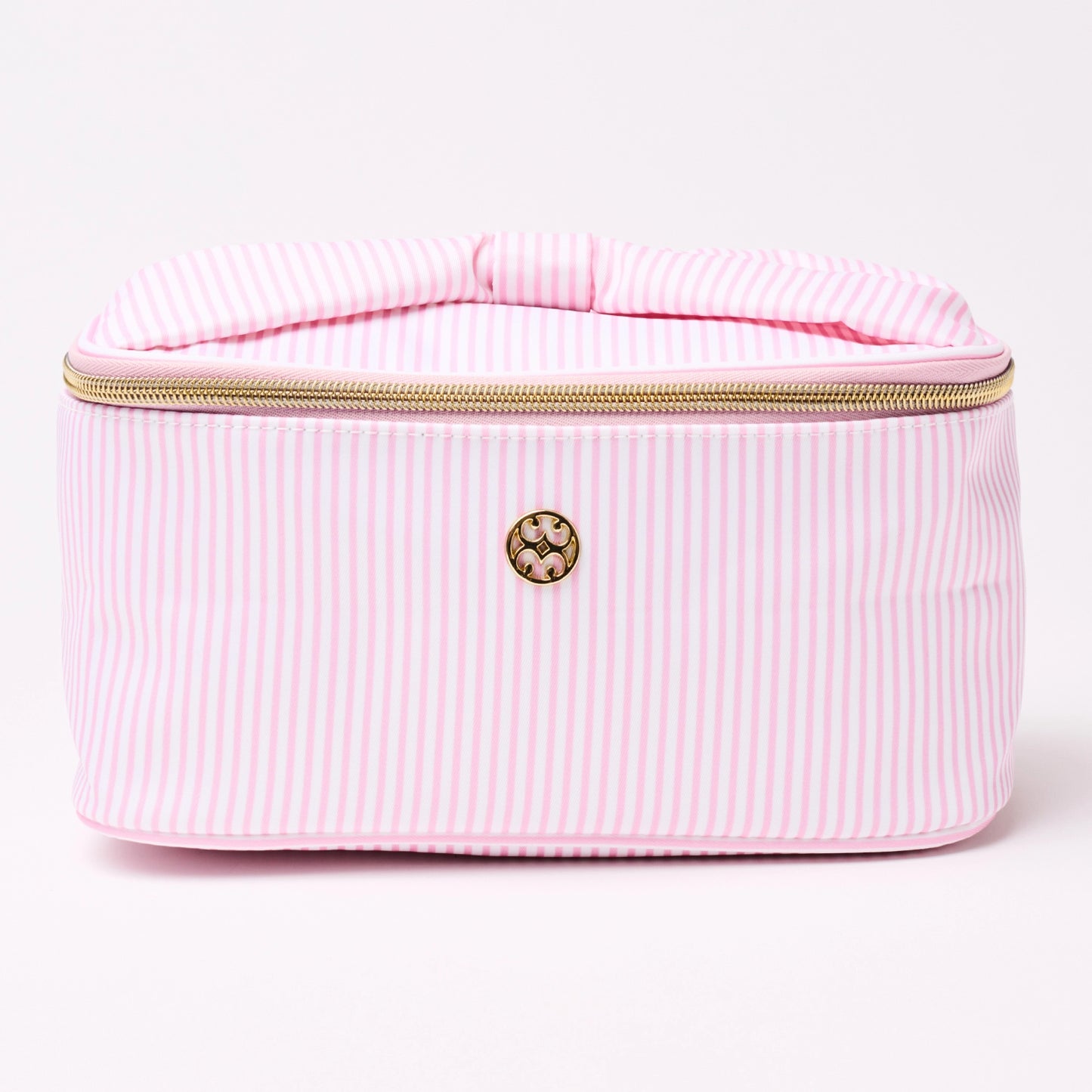 Pink striped make-up bag with gold zipper and a bow handle