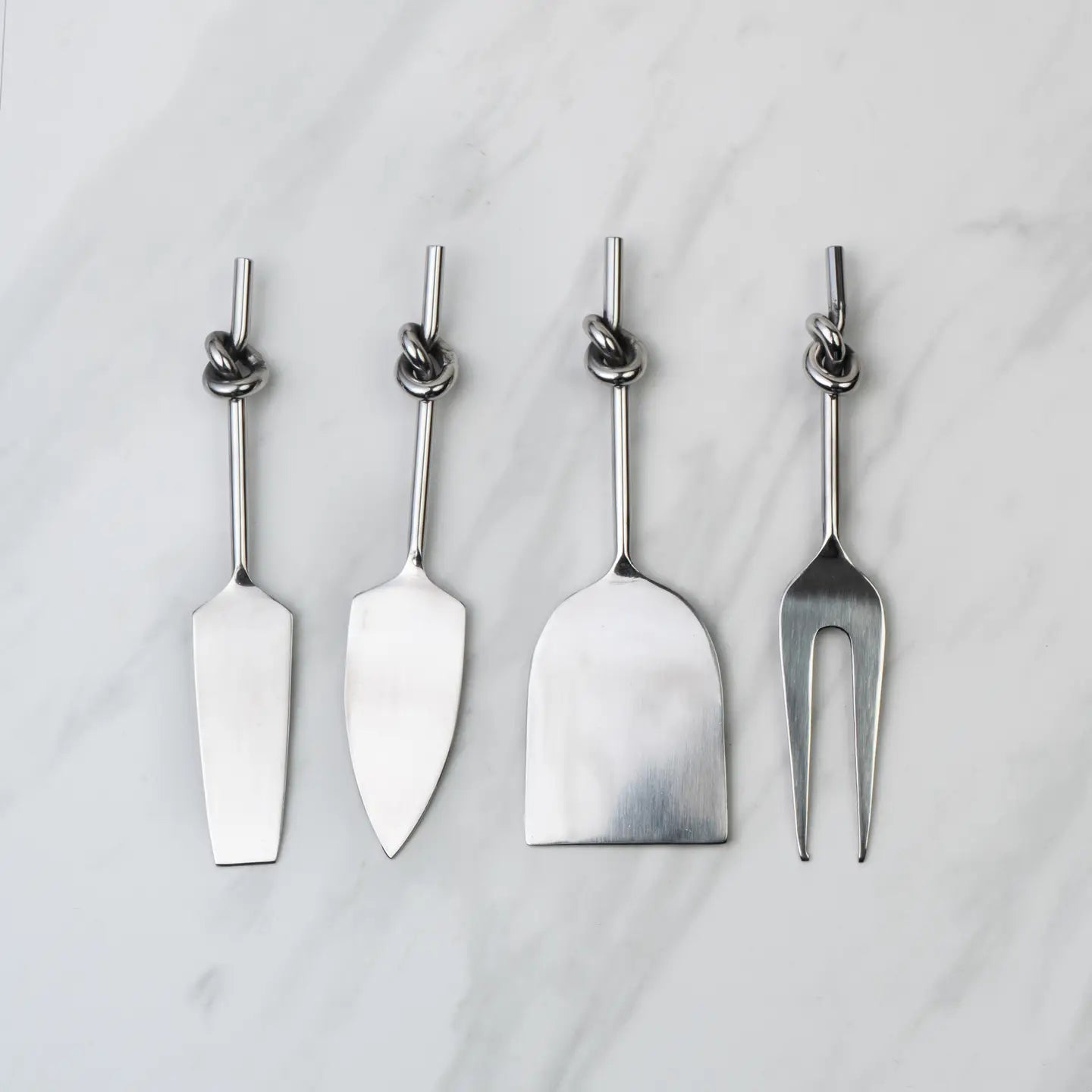 A set of four stainless steel cheese tools with knot handles.