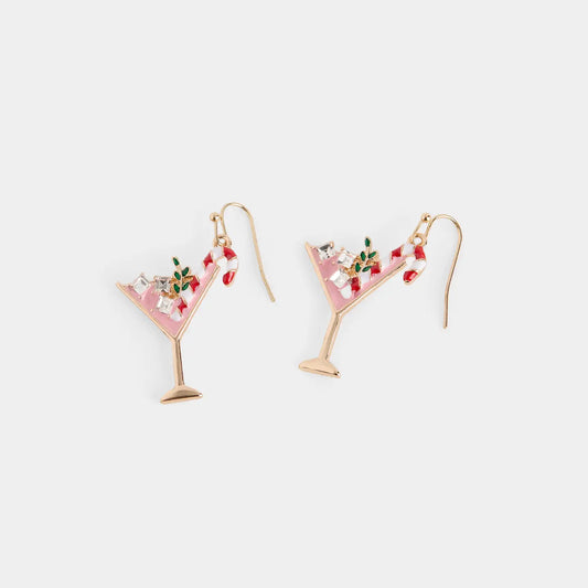 A pair of gold-tone dangle earrings shaped like pink martini glasses, decorated with small red berries, green leaves, and clear rhinestones.