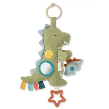 Children's dinosaur Itzy Ritzy Bitzy Traveler Developmental Sensory Toy - Dinosaur toy with colorful elements on a white background