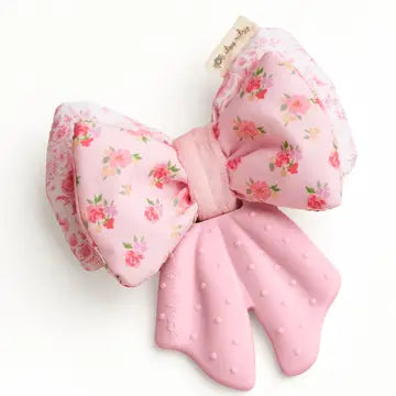 Pink floral bow Itzy Ritzy Teensy Crinkle Sensory Teether  - Pink Bow on a white background