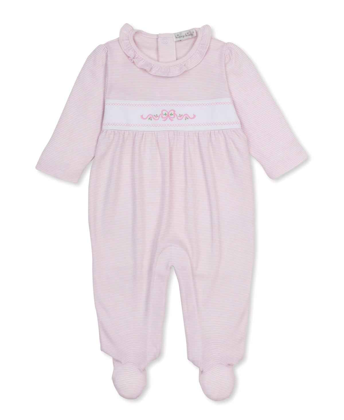 A Kissy Kissy Classic Treasures light pink baby footed sleeper with long sleeves, a ruffled collar, and a smocked chest detail with a bow motif, shown on a plain white background.