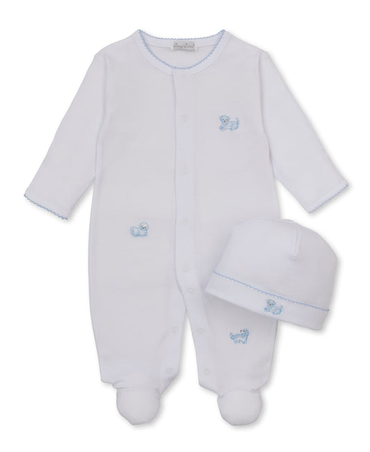 A white long-sleeve baby footie and hat set with light blue scalloped trim and a small blue embroidered puppy