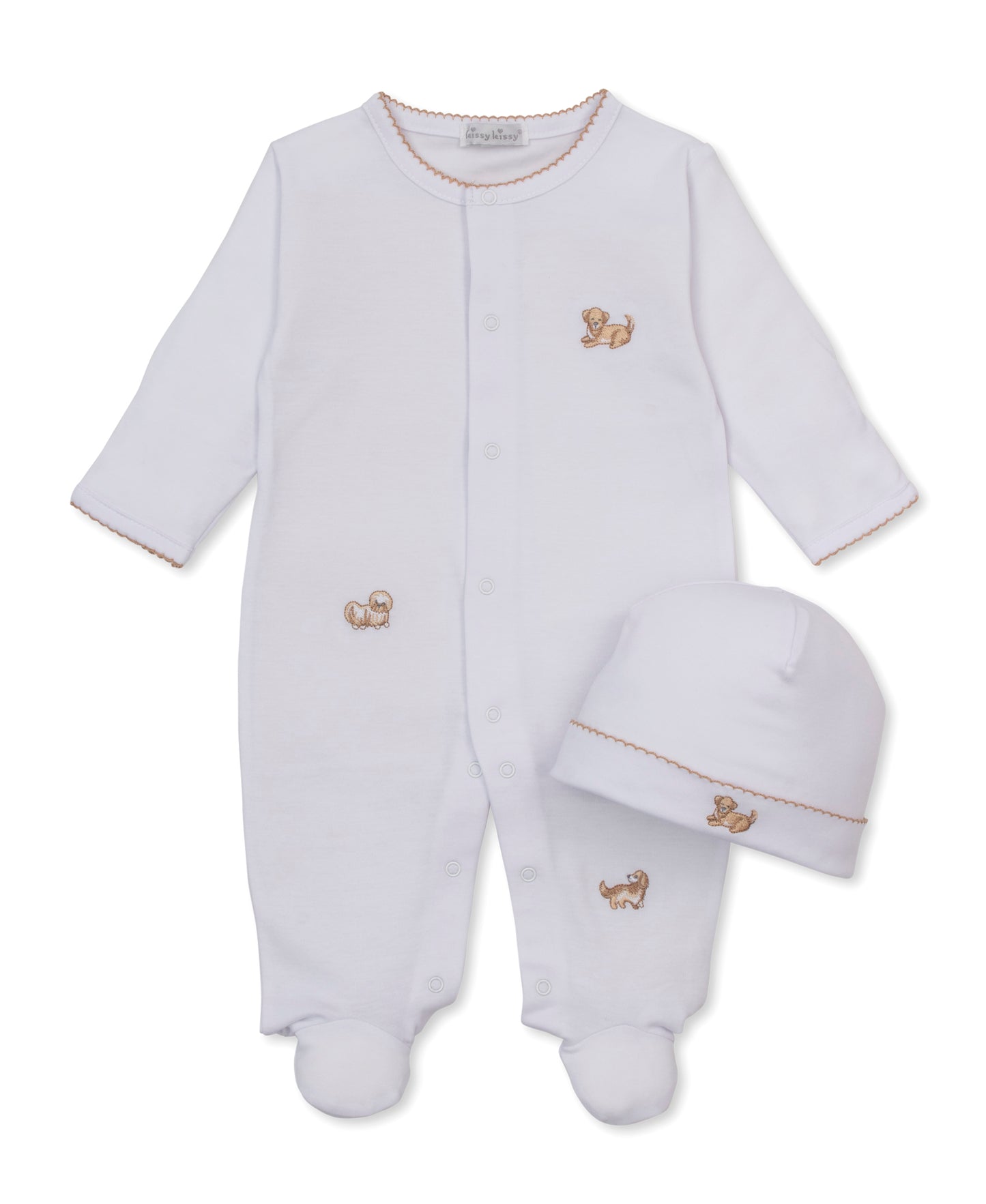 White baby footed sleeper and matching hat set with small, embroidered puppy motifs and brown trim on a white background.