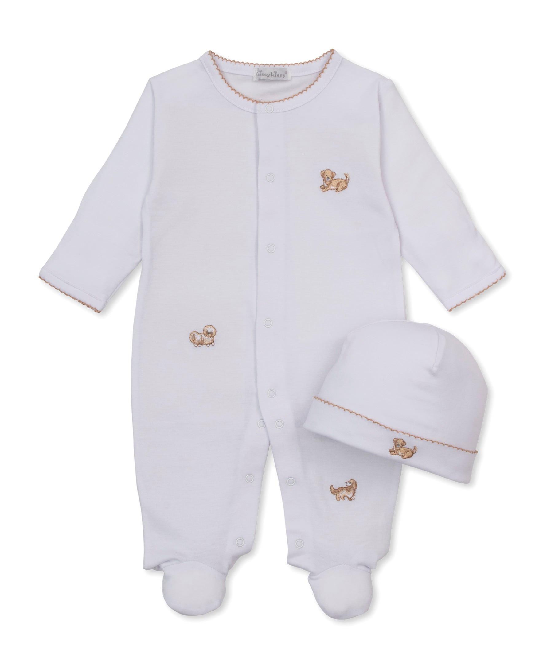 White baby footed sleeper and matching hat set with small, embroidered puppy motifs and brown trim on a white background.