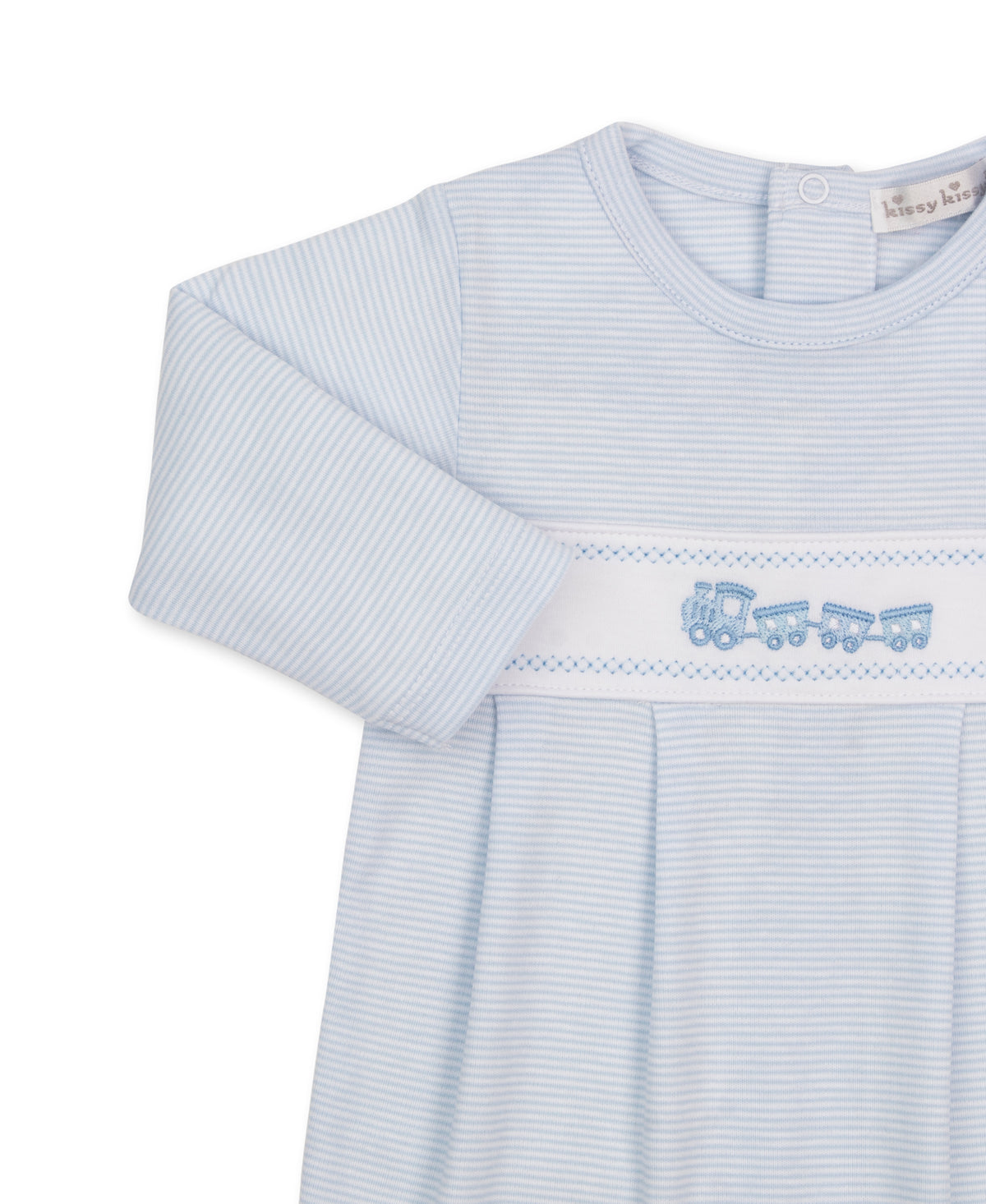A close-up of a Kissy Kissy Classic Treasures baby long-sleeve dress with light blue and white stripes, featuring a decorative band across the chest with a blue embroidered train motif.