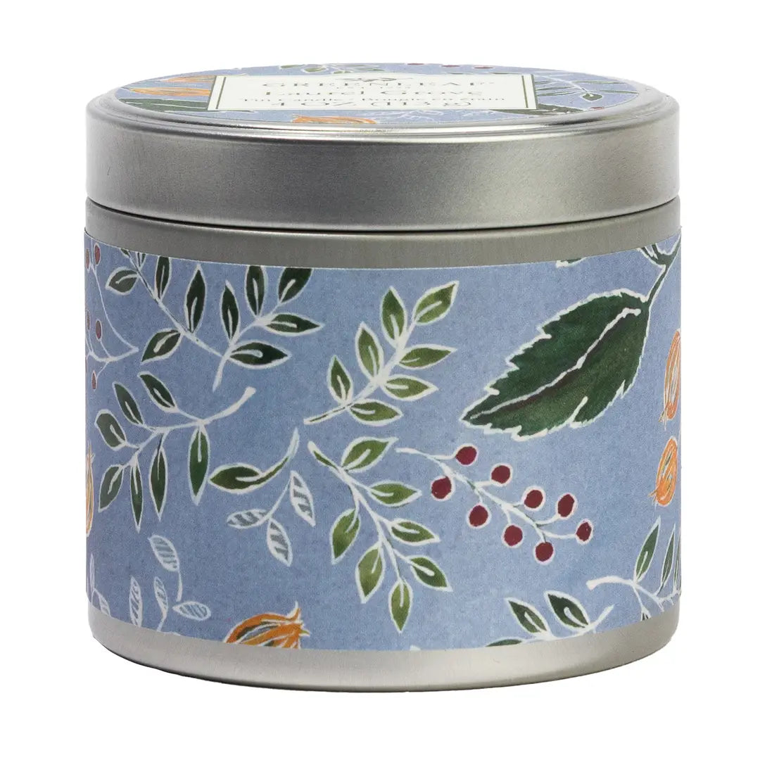 Candle tin with floral design on a blue background with the laurel grove fragrance