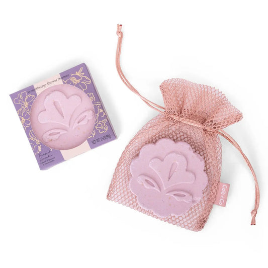 lavendar shower steamer in a mesh drawstring bag with text lavendar vanilla