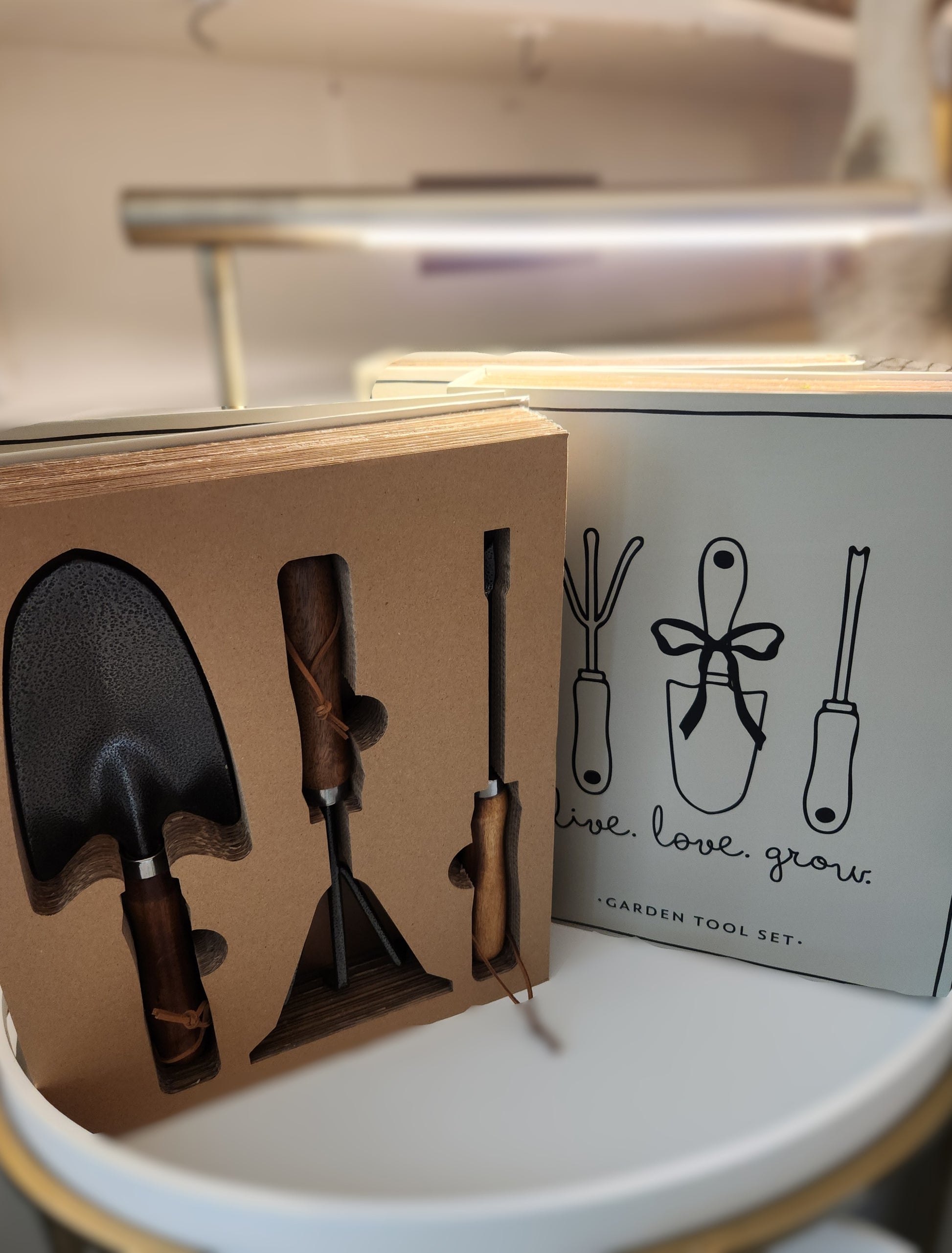 Garden Live love grow tool set packaging with tools inside, on a white surface at the Little Exchange